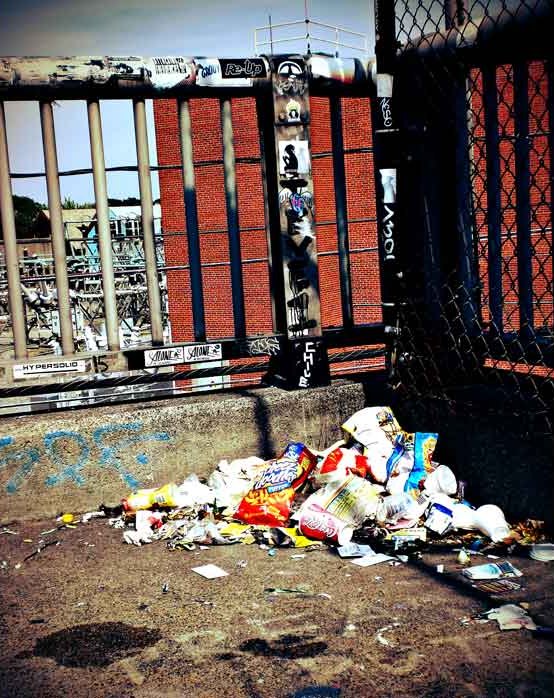 Photograph by Craig Witte exploring the abstract beauty of urban trash and shadow play.