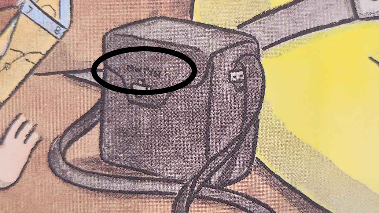 Close-up of a hidden name lettered on a camera case on page 3 of Curious George and the Hot Air Balloon